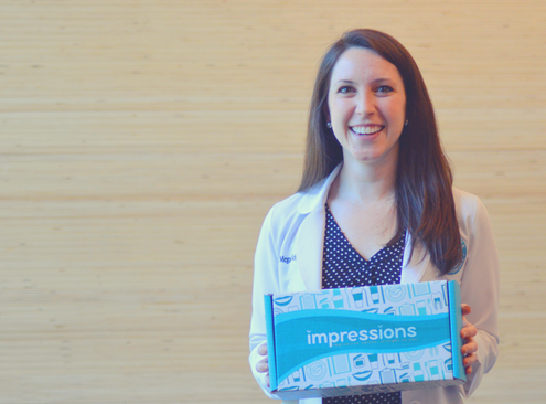 Dr Schüler holds the at home Impressions invisible aligners kit