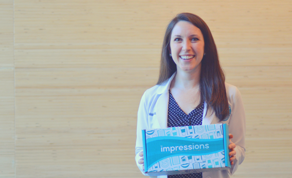 Dr Schüler holds the at home Impressions invisible aligners kit