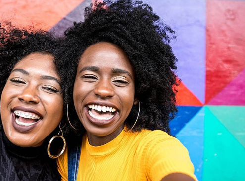 Two women share what their smiles mean to them in Asheville