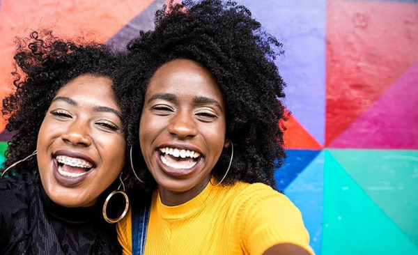 Two women share what their smiles mean to them in Asheville