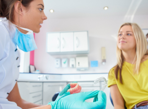 Woman learning about how she can straighten her teeth without braces at home