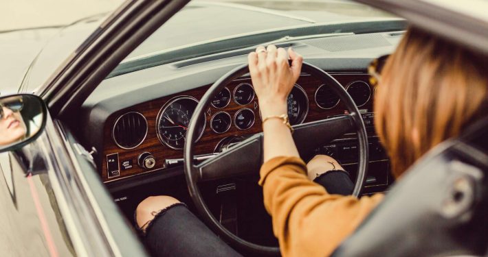 Woman riding in her car through Asheville, NC