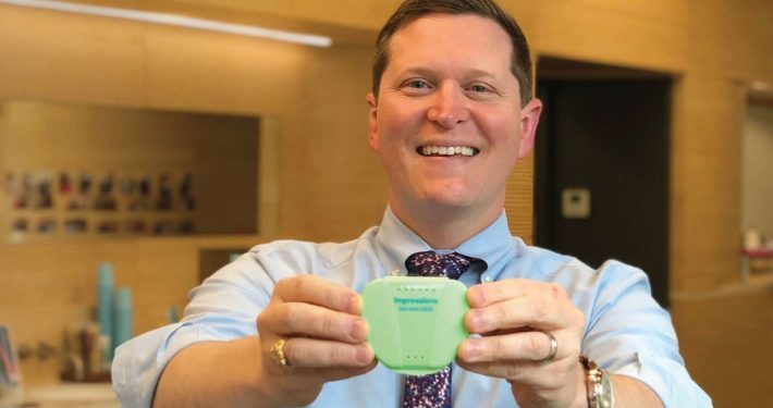 Dr Roberts shows off Impressions invisible aligners